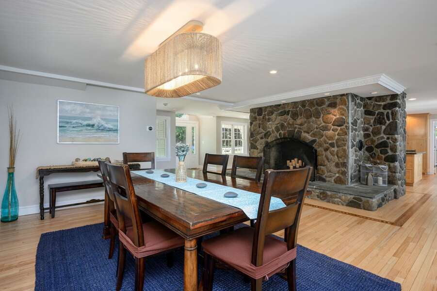 Dining area with center stone hearth -  192 Great Marsh Rd Centerville Cape Cod