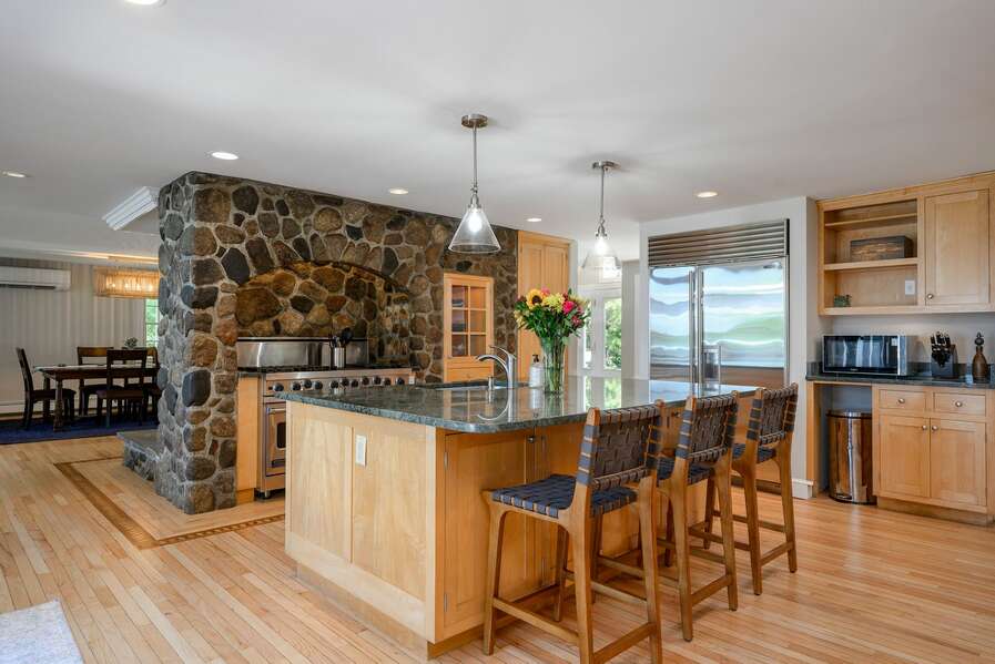 Kitchen with island and six-burner gas stove - 192 Great Marsh Rd Centerville Cape Cod
