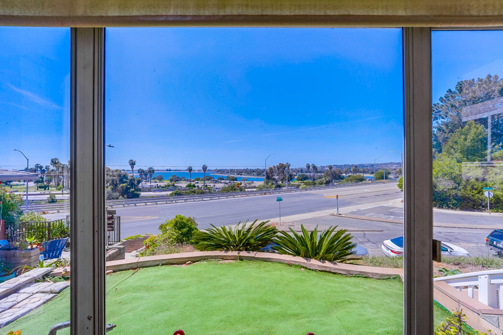 View of front yard and Mission Bay from sunroom