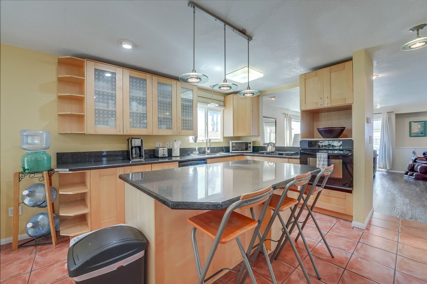 Kitchen fully equipped for meals at home and separate island, breakfast bar with seating for 3