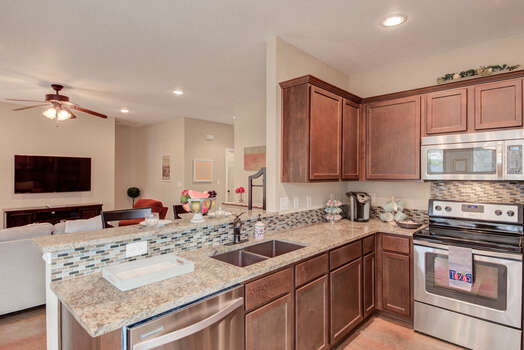Fully Equipped Kitchen with Stone Counters and Stainless Appliances
