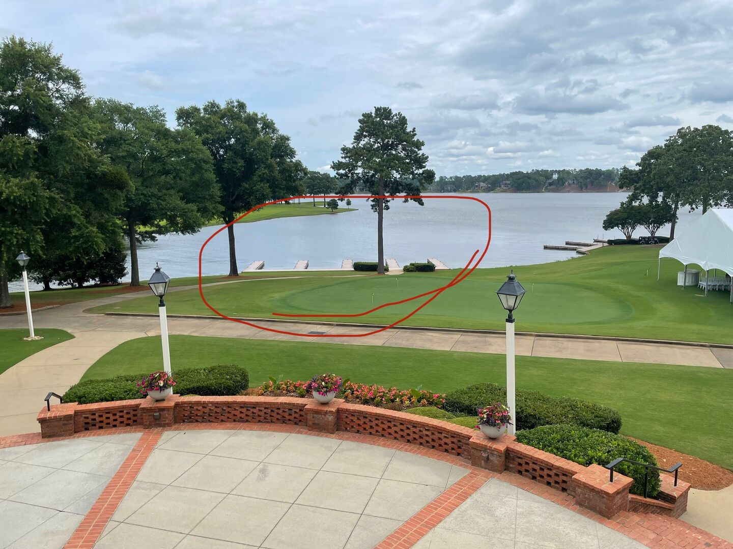 This is the view looking from the Great Waters Marina Clubhouse to the water. The docks circled are rarely used. The other set is used by golfers and diners. In the event that the dock at the house is full, boats can be parked here with a short walk back 