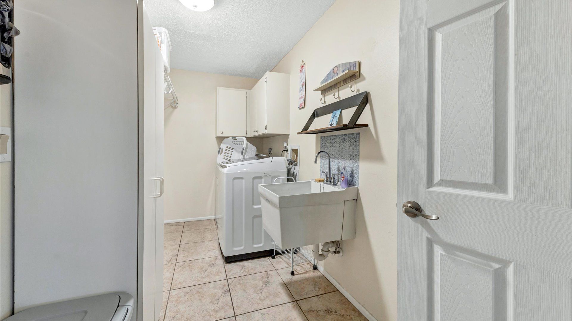 Full size washer and dryer in laundry room