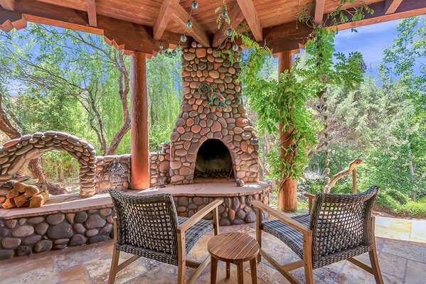 Enjoy the Beautiful Outdoor Landscape next to Stone Fireplace