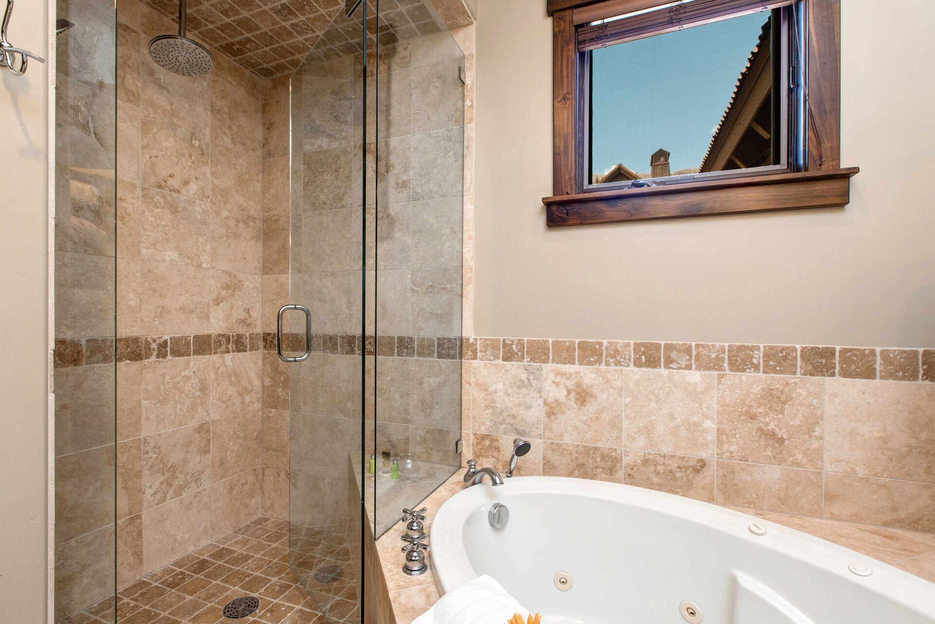 Master Bathroom with double sinks, walk-in shower, and jetted tub