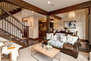 Living Room with plush leather sofa with sofa sleeper, rotating arm chairs, 65
