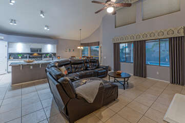 Spacious great room features well designed living spaces with excellent views of the backyard oasis.