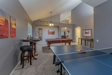 Wow! A dedicated game room with pool and ping pong tables and board games.