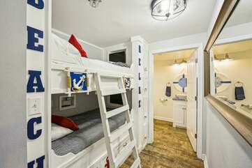 Custom Twin bunks with TVs for the kids to enjoy