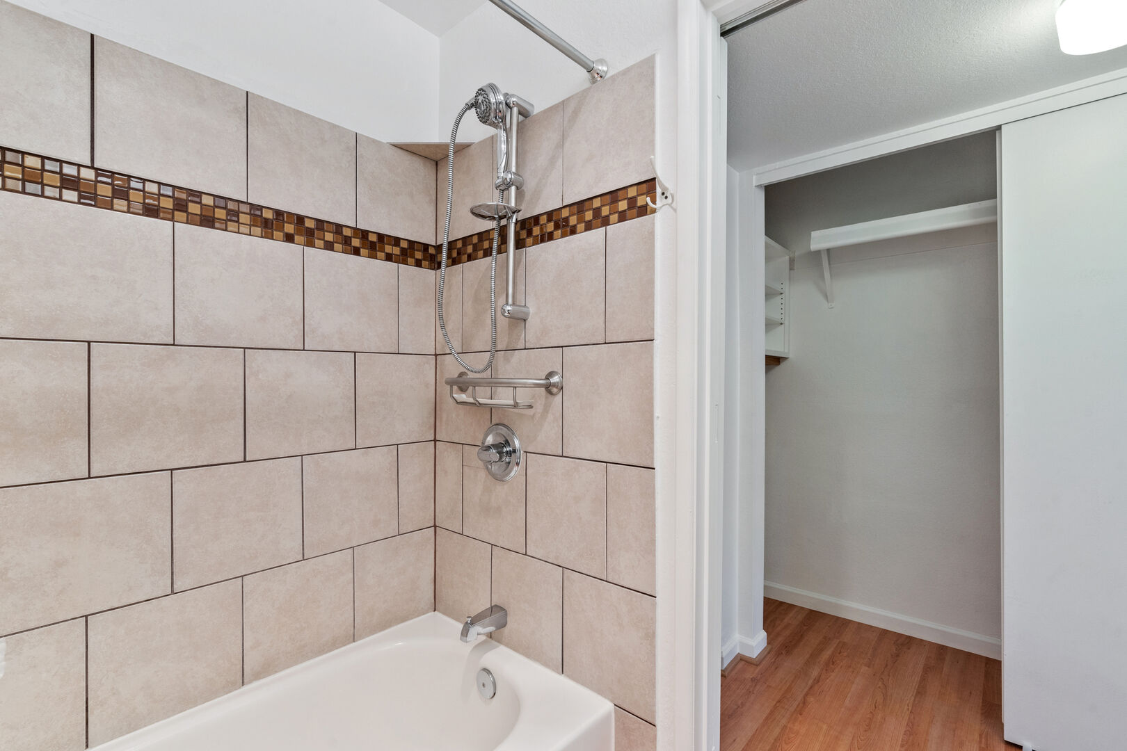 Master bath includes a large closet and has both a shower and tub.