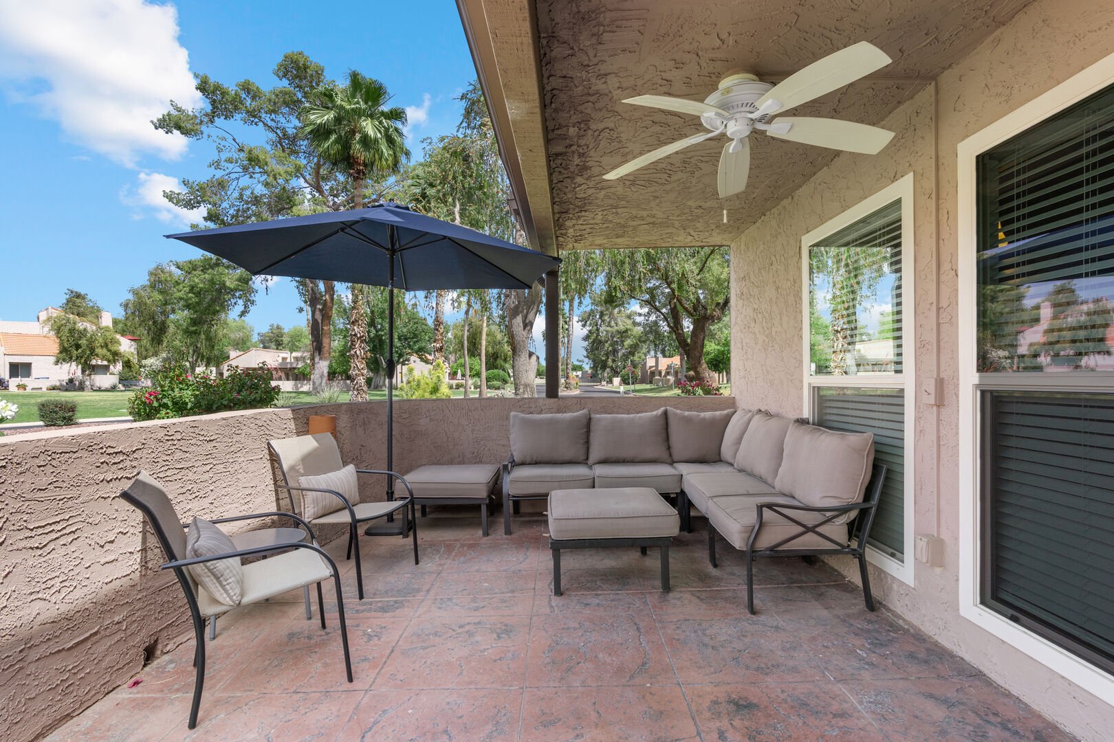 Lounge on the comfy outdoor seating area, the ceiling fan is a plus!