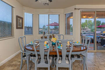 Transfer food and drink to backyard patio and pool through sliding doors in the dining area.