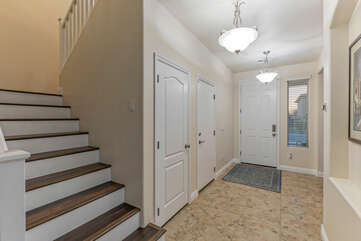 Stairs in entrance foyer lead to 4 bedrooms, 2 full baths and a furnished loft.