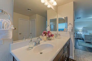 The primary bath has dual vanity sinks and space for 2 to prep for special occasions.