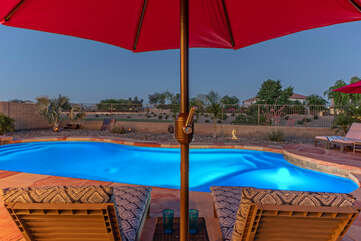 Our pool deck has comfortable seating and umbrellas for shade.