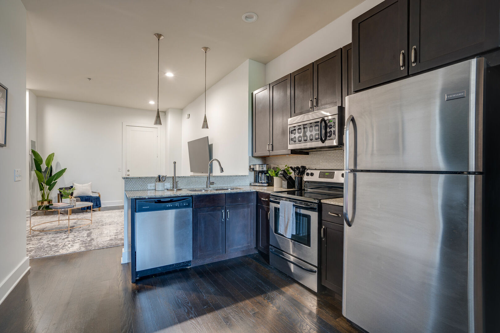 Fully equipped kitchen stocked with your basic cooking essentials. Complete with granite counter tops, stainless steel appliances, and breakfast bar seating.