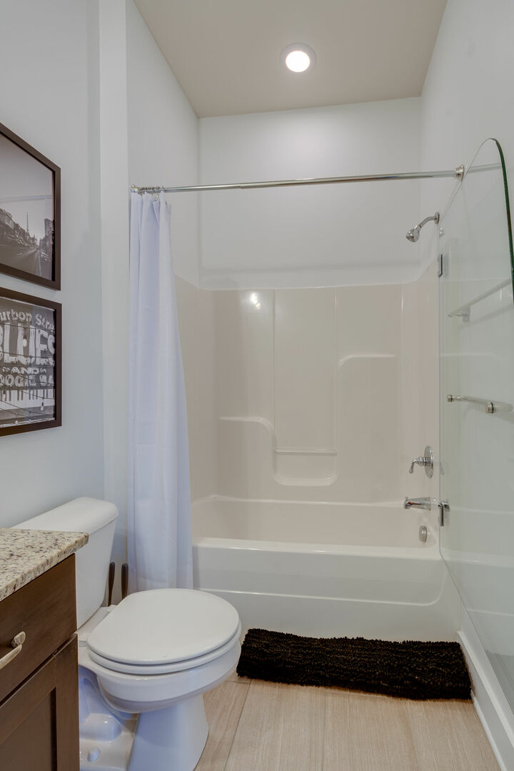 Bathroom with shower and tub combo.