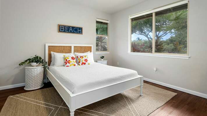 Guest bedroom with a queen bed is located on the lower level