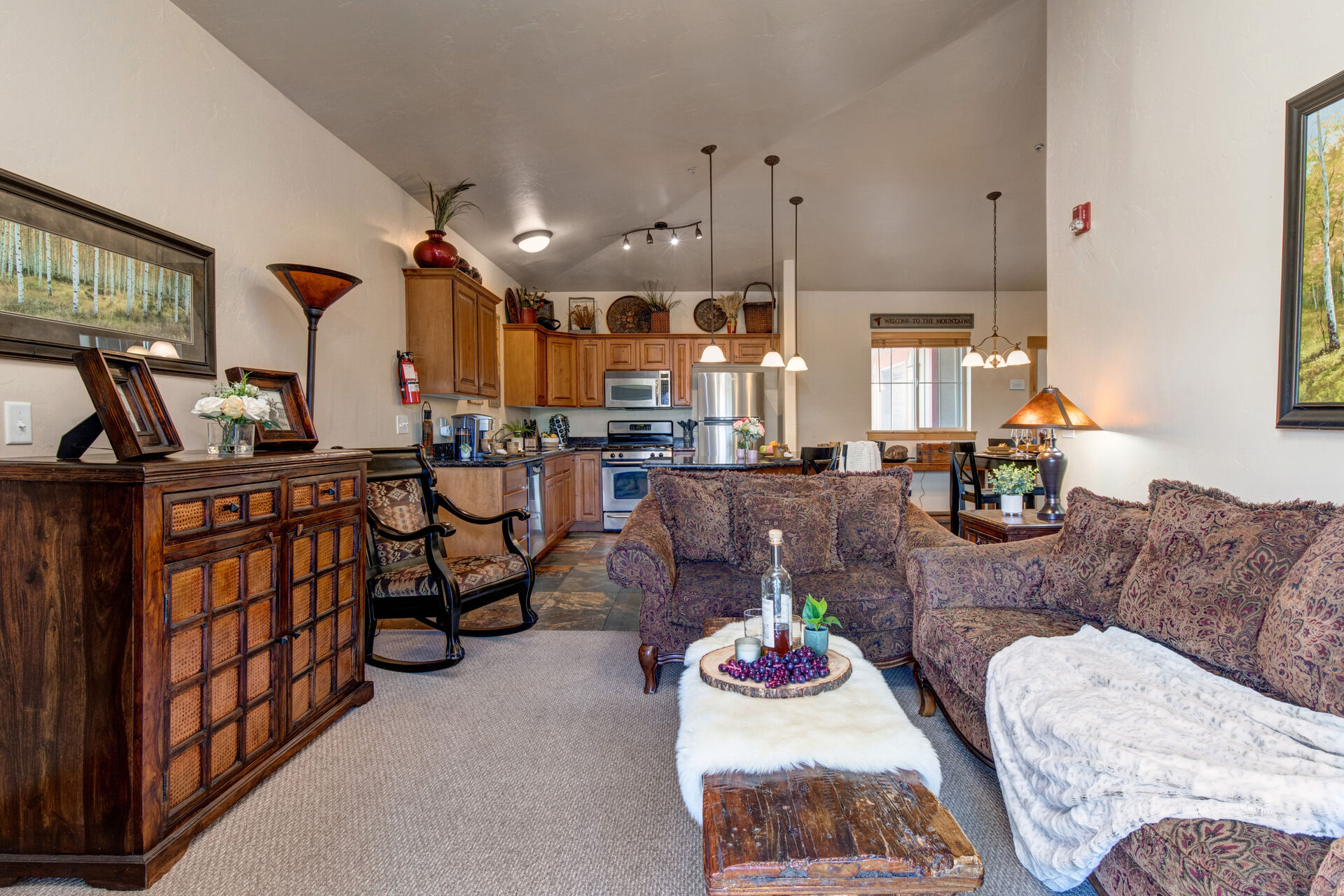 Living Room with plush sofa & loveseat, gas fireplace, 50