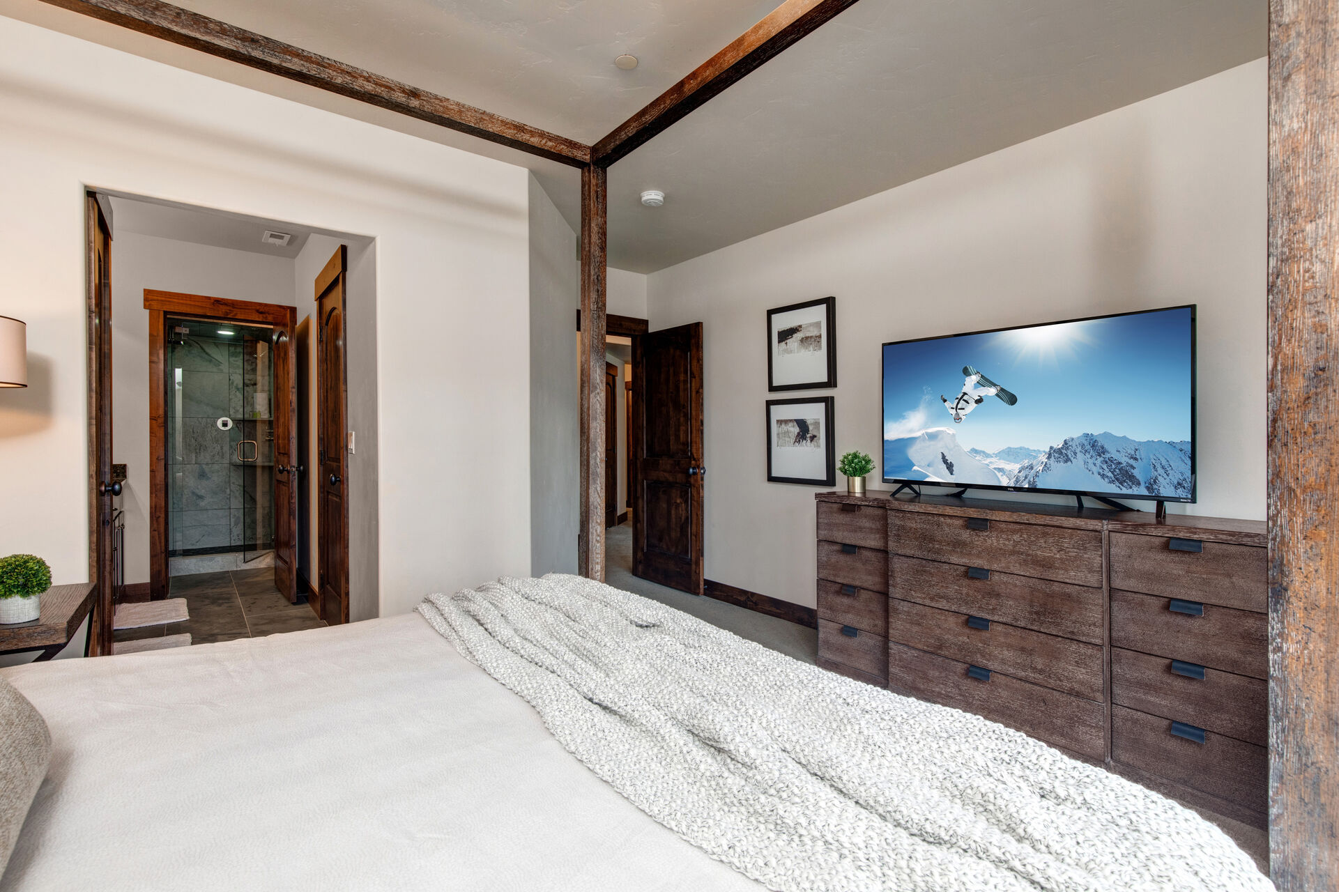 Lower Level Master Bedroom 2 with king bed, smart tv, and en suite bathroom