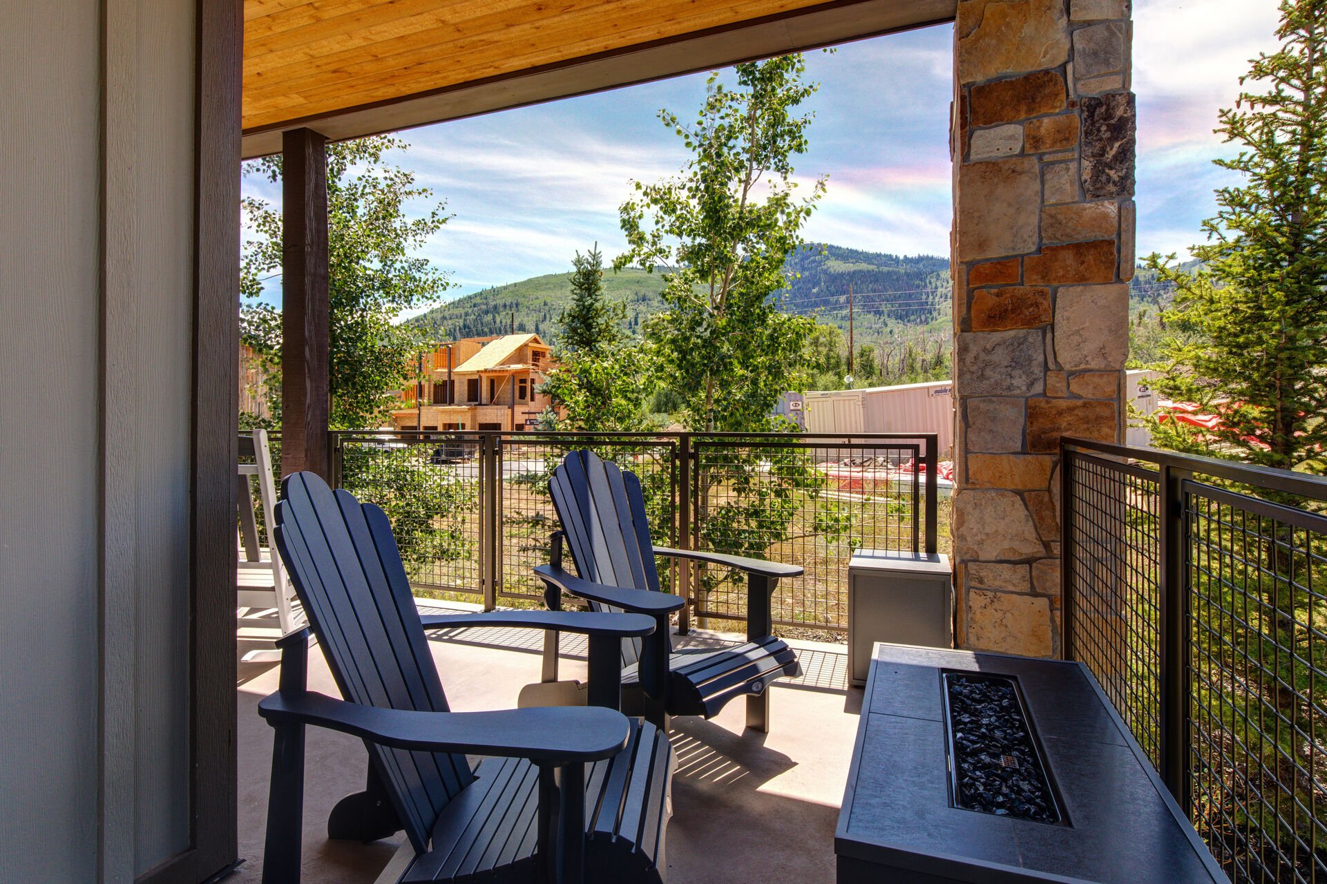 Private, wrap-around deck with rocking chairs, outdoor furnishings, BBQ grill, fire pit and breathtaking views of Canyons Gold Course & Resort