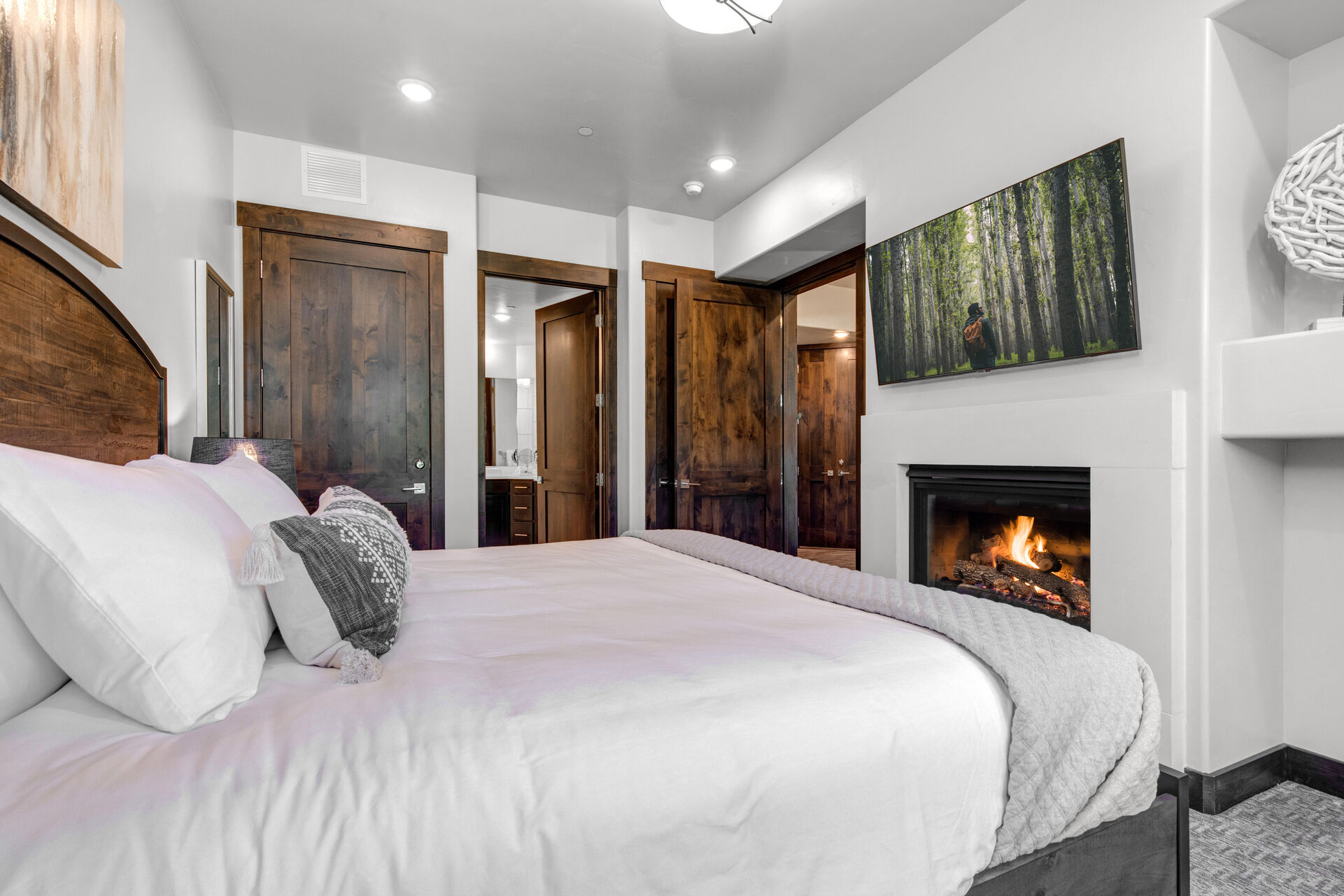 Bedroom 2 with queen bed, smart TV, gas fireplace and en suite bathroom