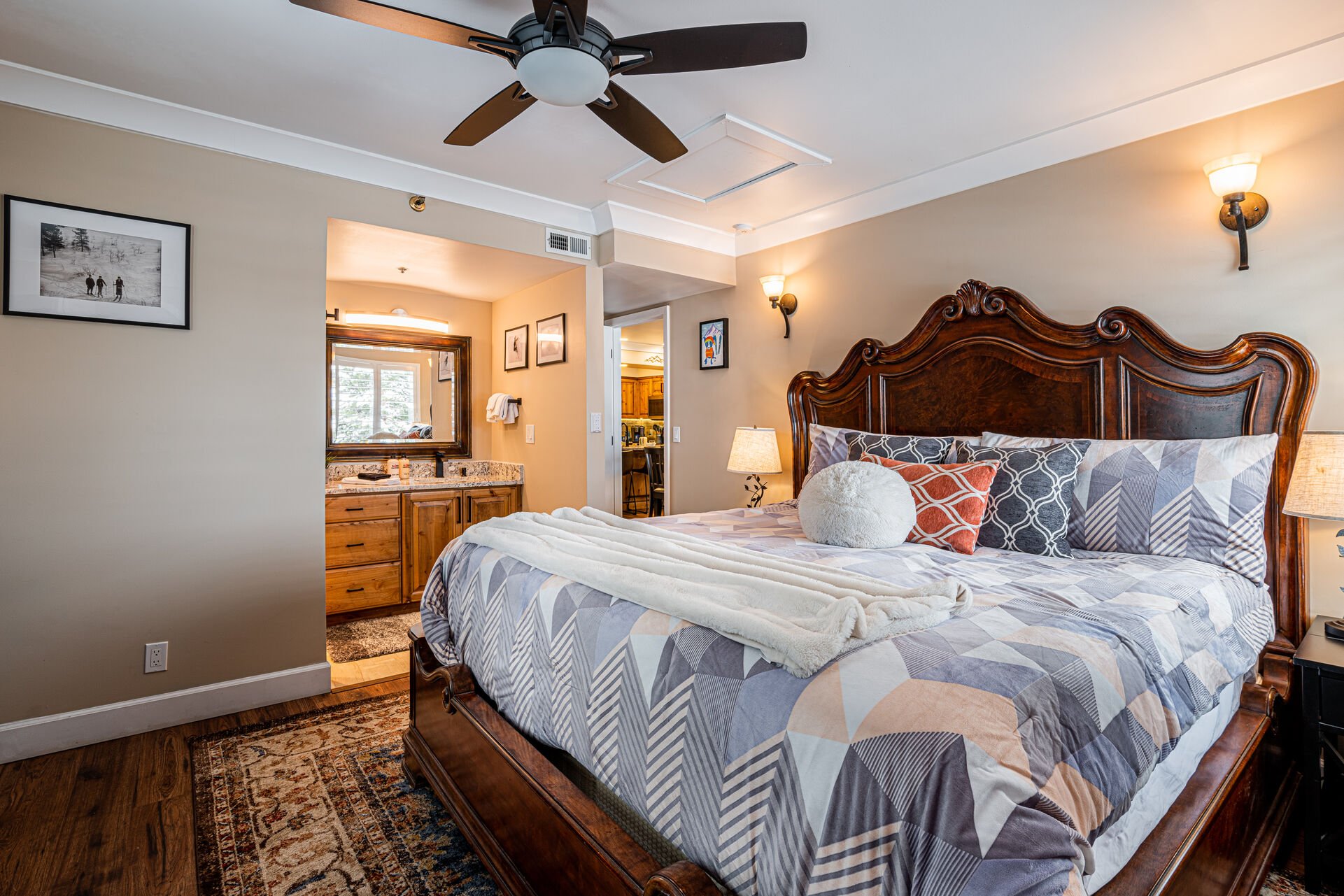 Master Bedroom with King bed and a 50” Smart TV, and private bathroom that offers a granite vanity and a brand new, over-sized tile and glass shower.