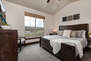 Main Level Master Bedroom 1 with king bed, smart tv, and en suite bathroom
