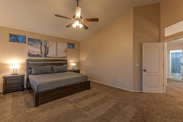 Expect peaceful slumber in the primary suite which is upstairs and features a king bed and ceiling fan.