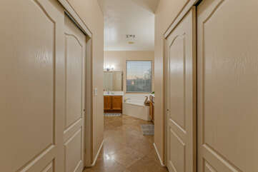 The en suite primary bath includes walk-in closets.