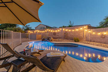Backyard oasis overflows with ambiance. All that's missing is YOU!