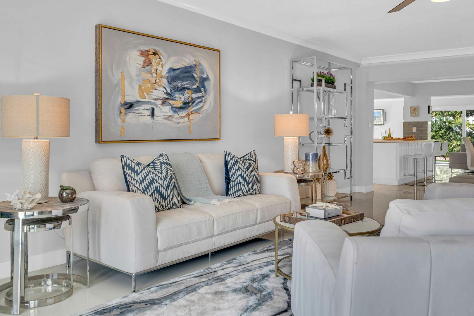 The sitting area is decorated with artistic pieces that complements the clean and beachy aesthetic of Ocean Mist Key.