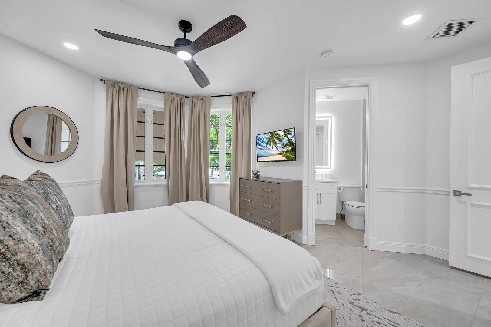Bedroom Four boasts a king size bed, smart TV, and an ensuite bathroom.