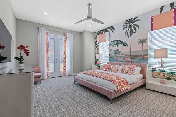 This Floridian themed master suite features a king size bed and en-suite bathroom. Located on the second floor.