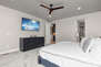 Grand Master Bedroom with a King Bed and Smart TV