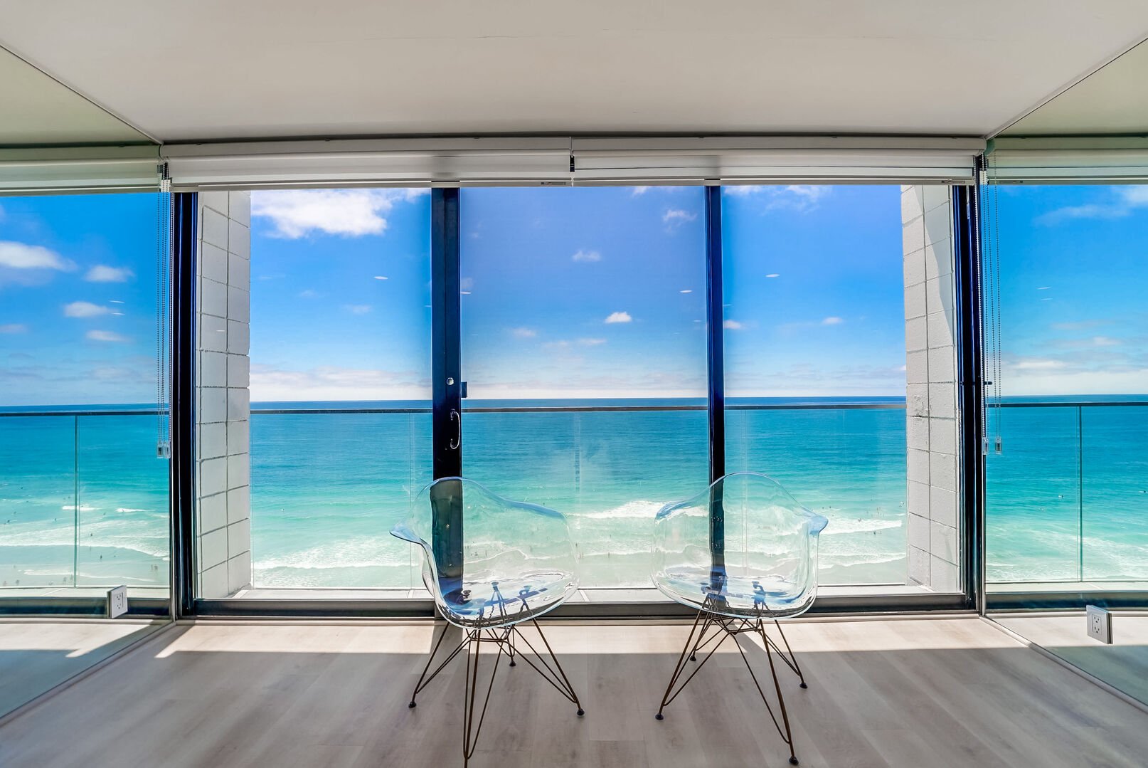 Floor to ceiling windows to the ocean! The sliding door opens to welcome in the sea breeze. Balcony area is not for sitting, view only!