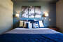 The second bedroom feature a queen size bed.