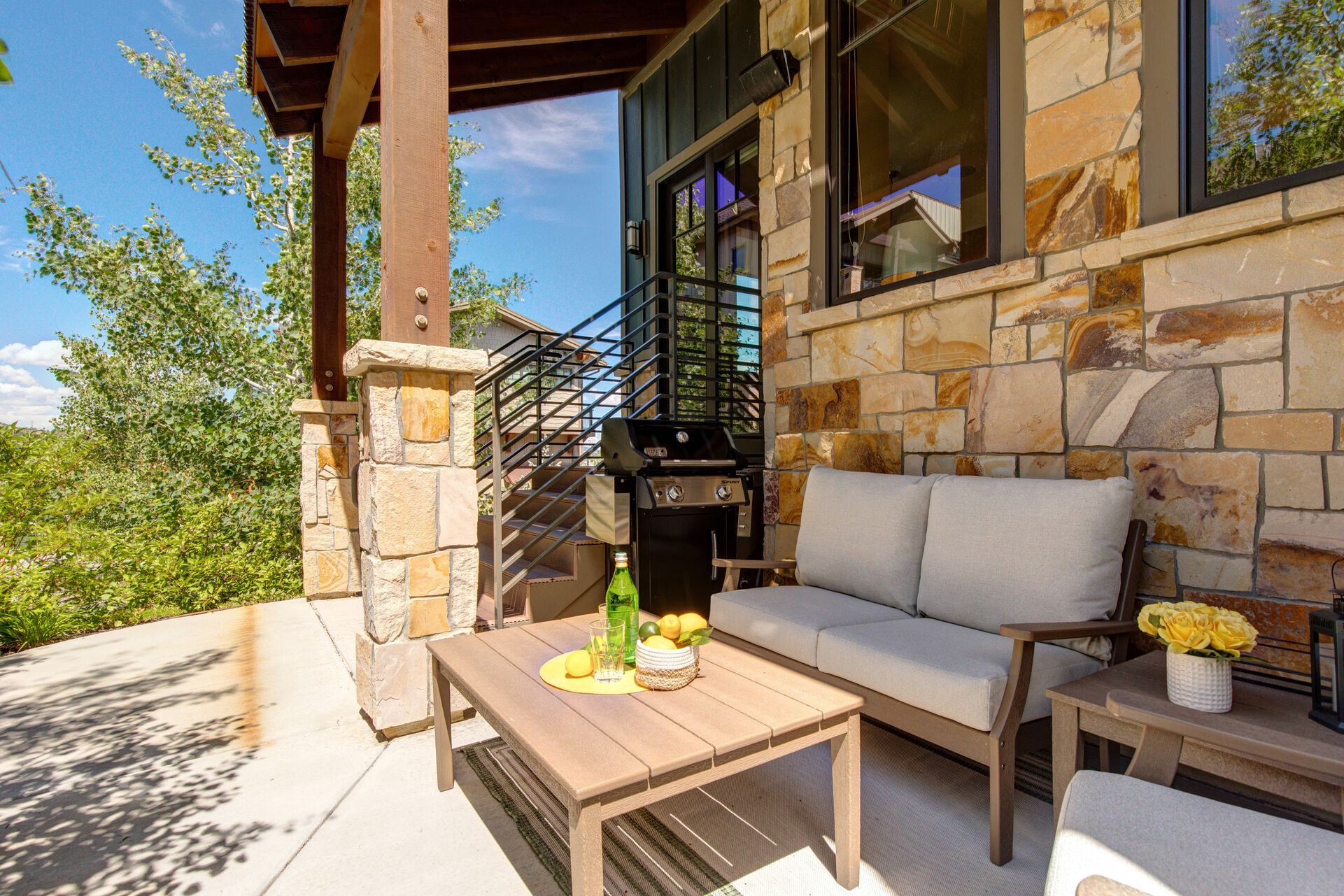 Private Patio with gas Weber grill and beautiful outdoor furnishings