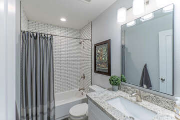 Newly remodeled Bathroom 1 has a tub-shower combo and is a private bath for Bedroom 1.