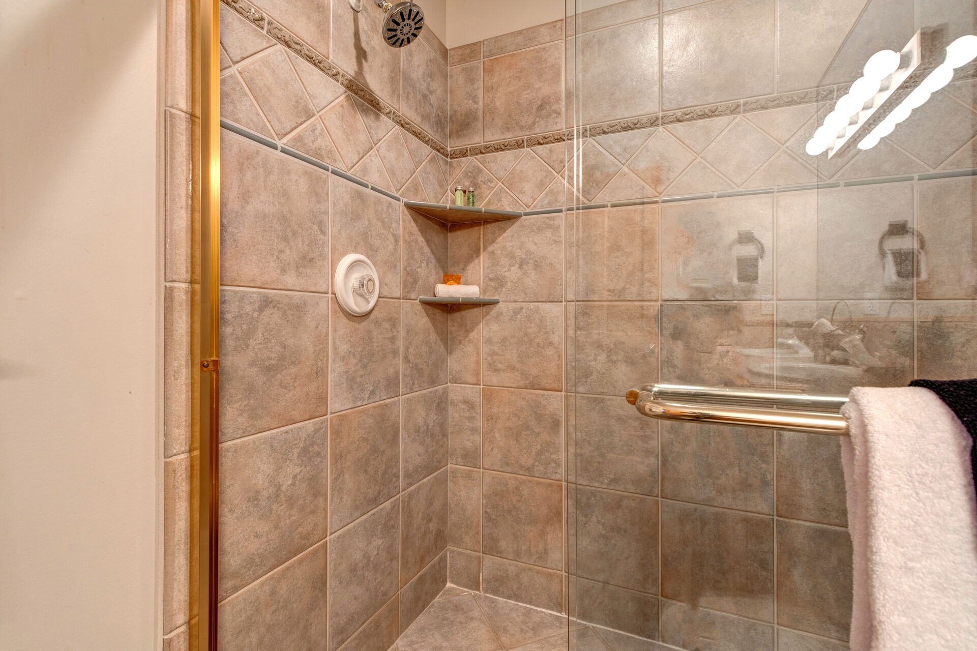 Main Level Shared Full Bathroom with over-sized tile shower