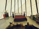 A comfortable queen bed and couch awaits you in the tipi!
