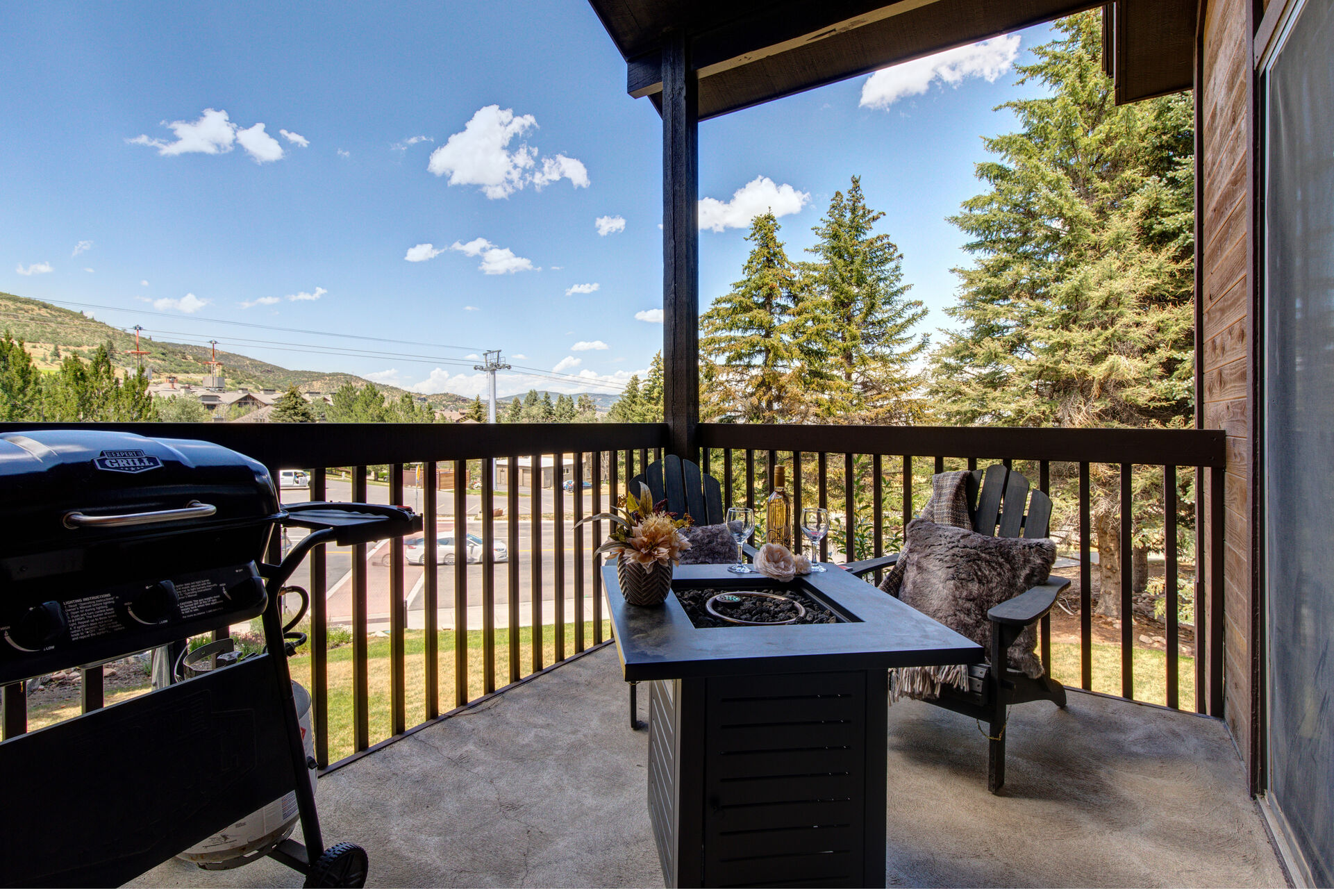 Private deck overlooking the Canyons Cabriolet with BBQ grill, fire-pit, and Adirondack chairs