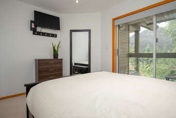 Second bedroom with queen bed and smart TV and private balcony