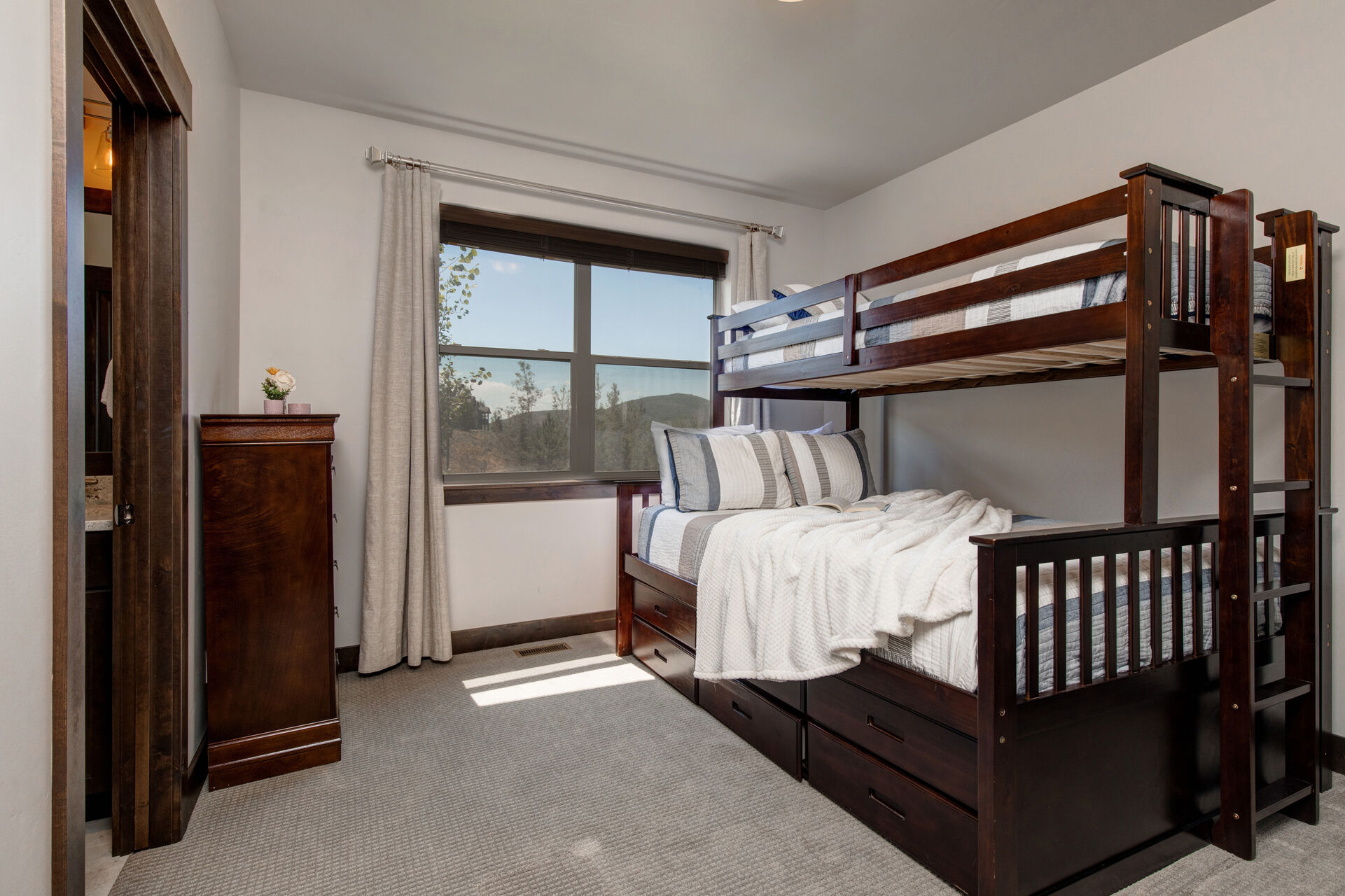 Main Level Bedroom 2 with XL Twin over Queen Bunk Beds and Private Access to Shared Bath