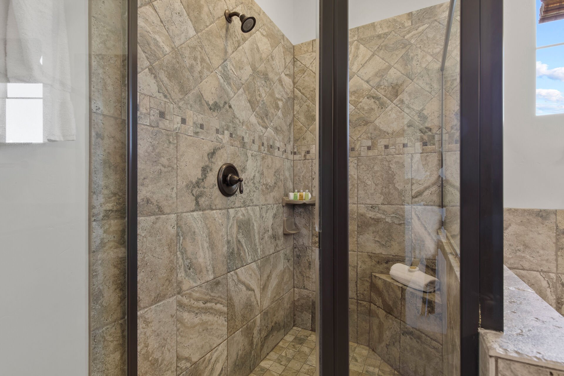 Master Bathroom with double sinks, tub, and shower