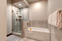Master Bath with a Soaking Tub and Tile/Glass Shower