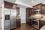 Fully Equipped Kitchen with gorgeous stone countertops, stainless steel appliances, ice maker, and bar seating for 3