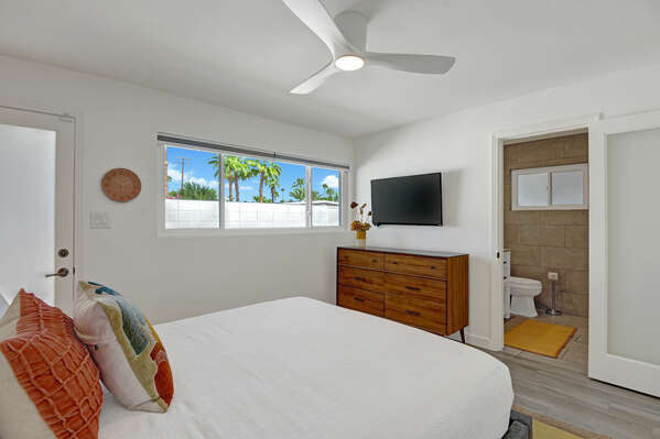 MASTER BEDROOM WITH ACCESS TO THE FRONT COURTYARD.  EN-SUITE MASTER BATH.  SMART TV ON THE WALL.