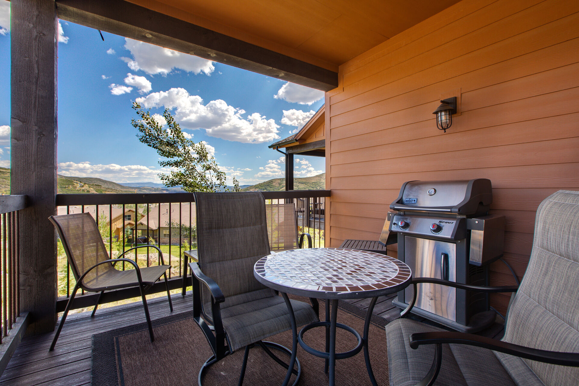 Covered Deck with Patio Seating and a Natural Gas BBQ