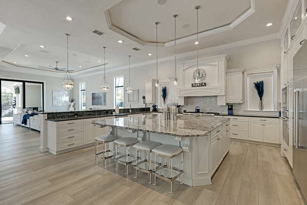 Everyone can be together in this open kitchen with additional seating